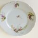 Series of eight porcelain dessert plates