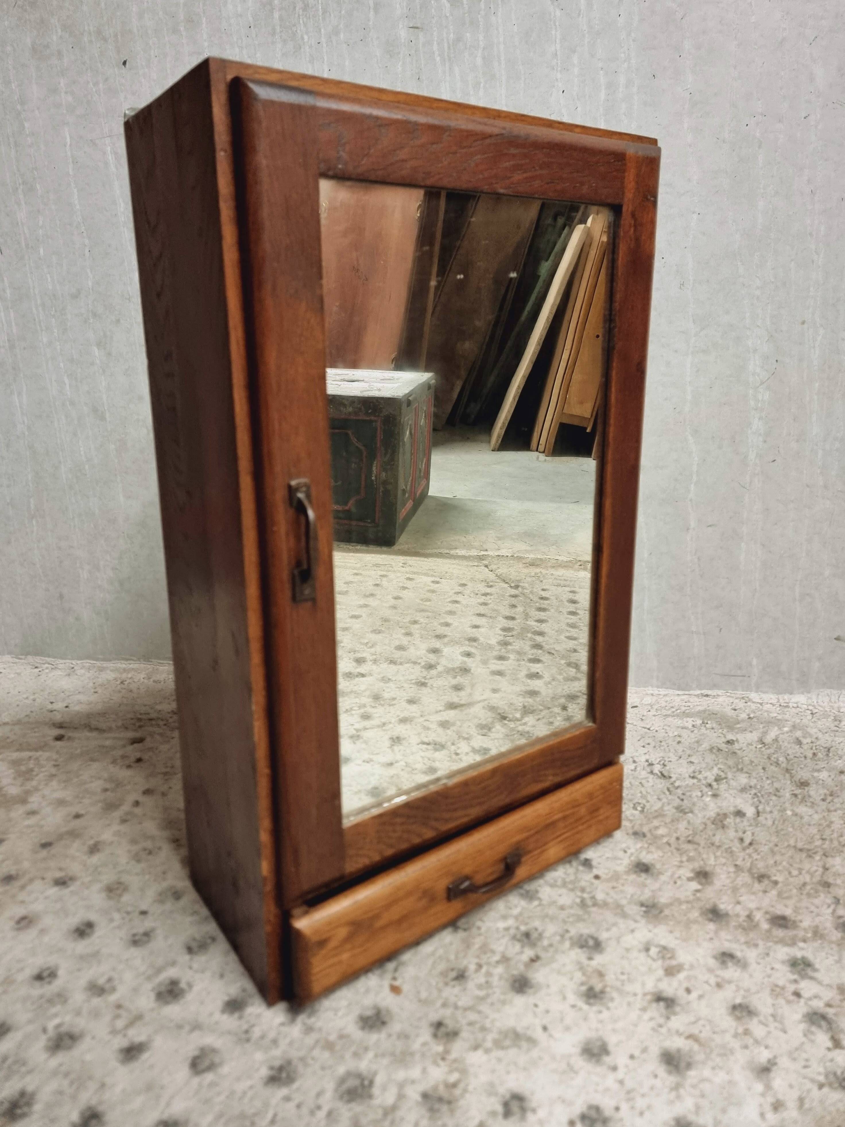 Old hanging cupboard medicine cabinet with mirror and drawer