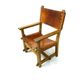 Chaise de château brutaliste ancienne faite à la main en chêne et cuir cognac, années 1920.