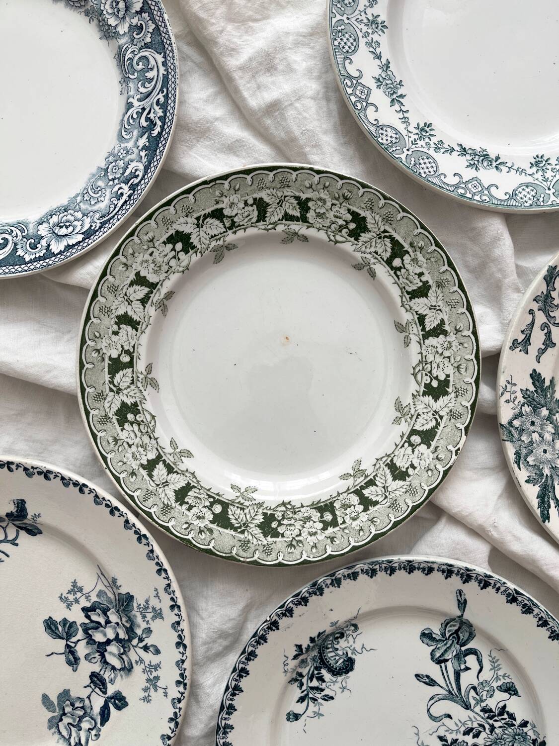 6 mismatched Saint Amand ironware dessert plates