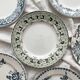 6 mismatched Saint Amand ironware dessert plates