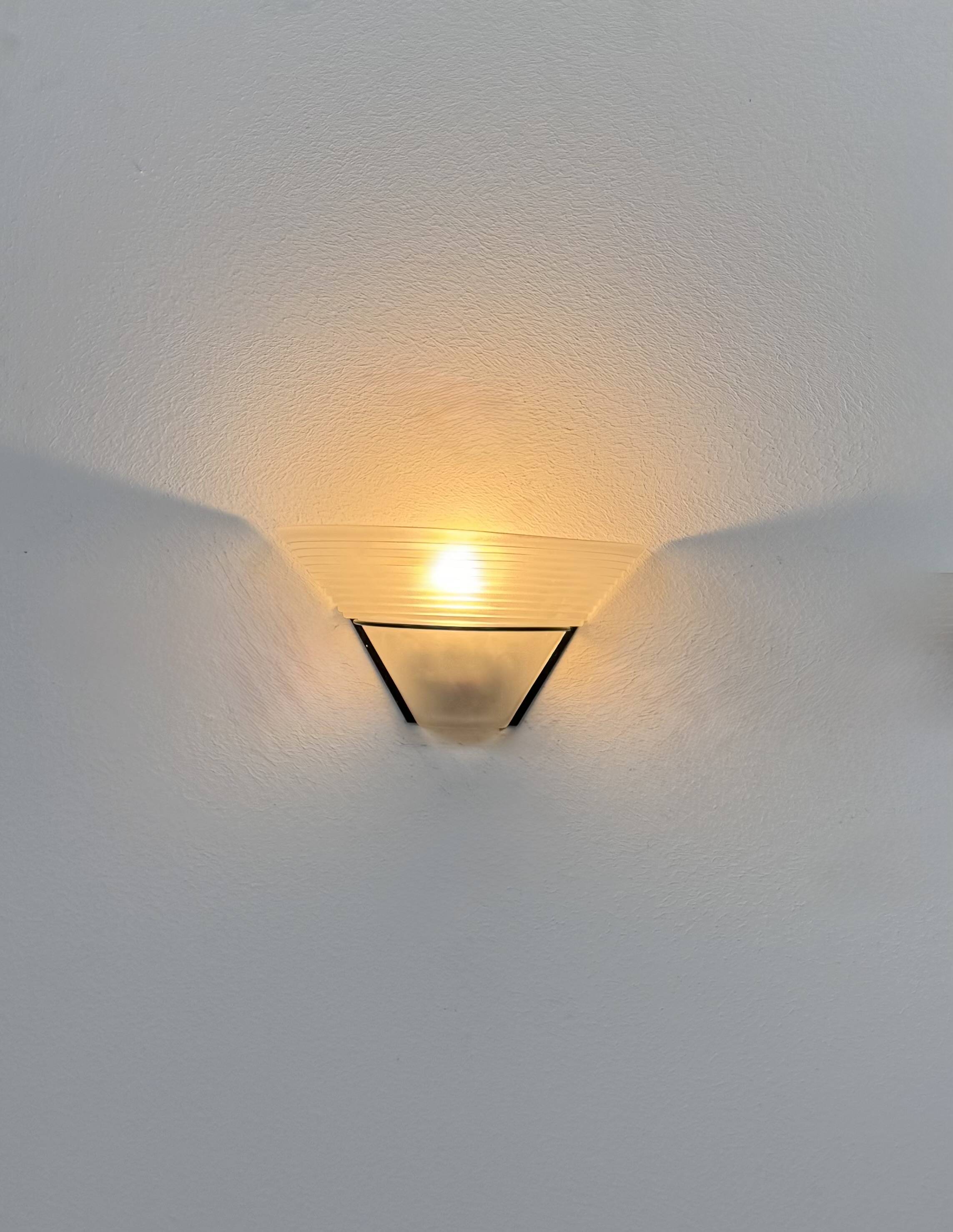 Frosted glass and black metal wall light, Italy, 1980.