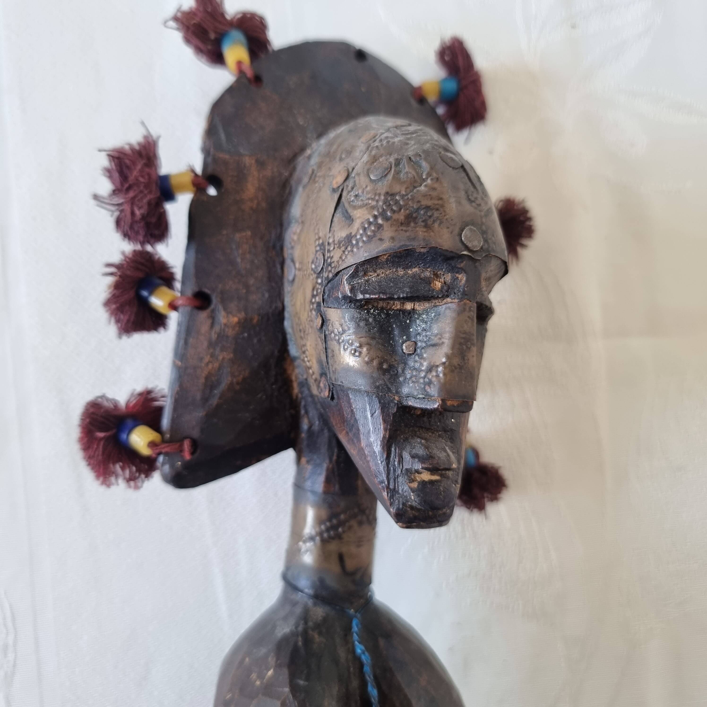 Scepter decorated with a female figure in wood and brass