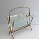 Bamboo-style brass magazine rack from the Baguès house.