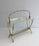 Bamboo-style brass magazine rack from the Baguès house.