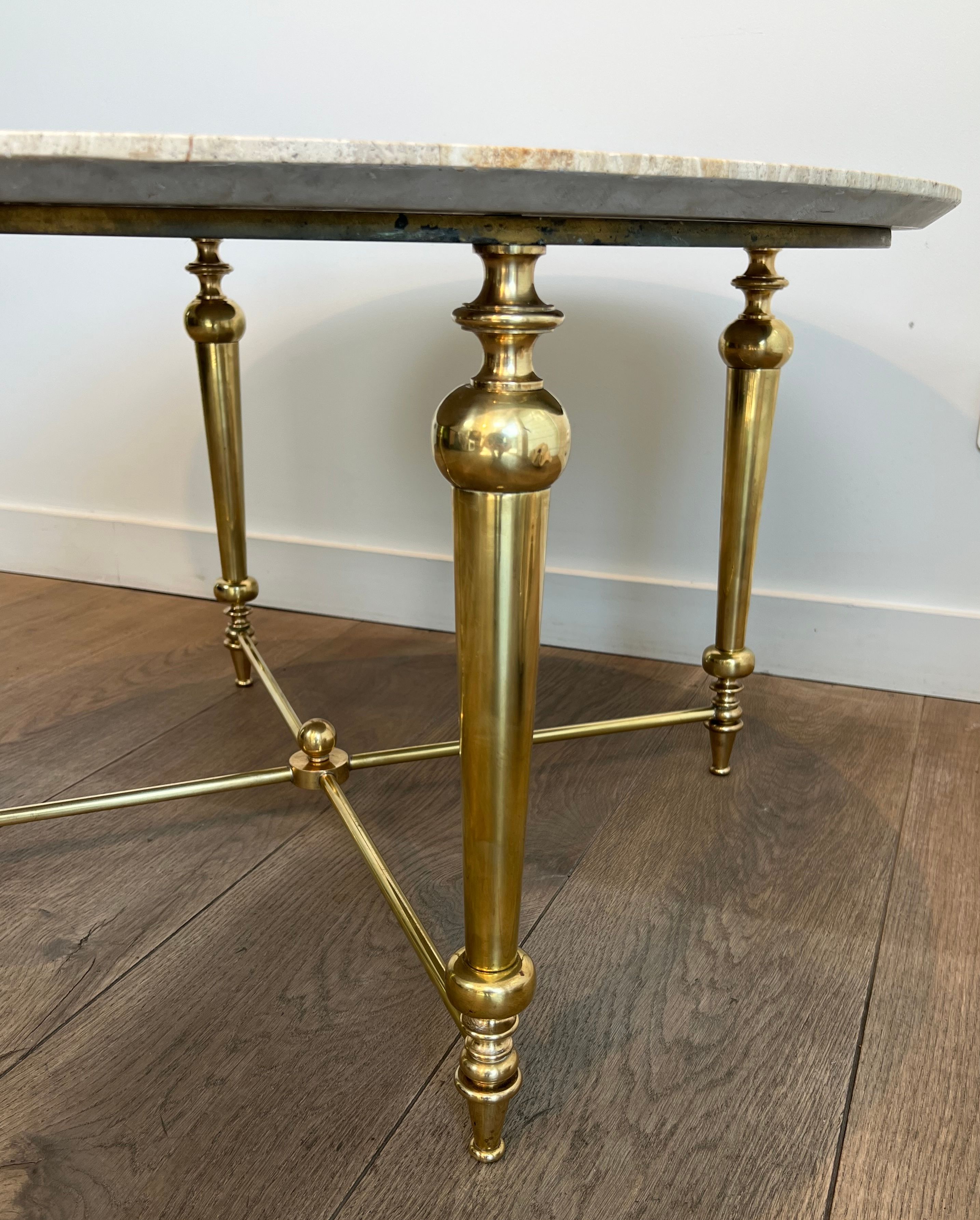Brass coffee table with a white marble top.