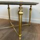 Brass coffee table with a white marble top.