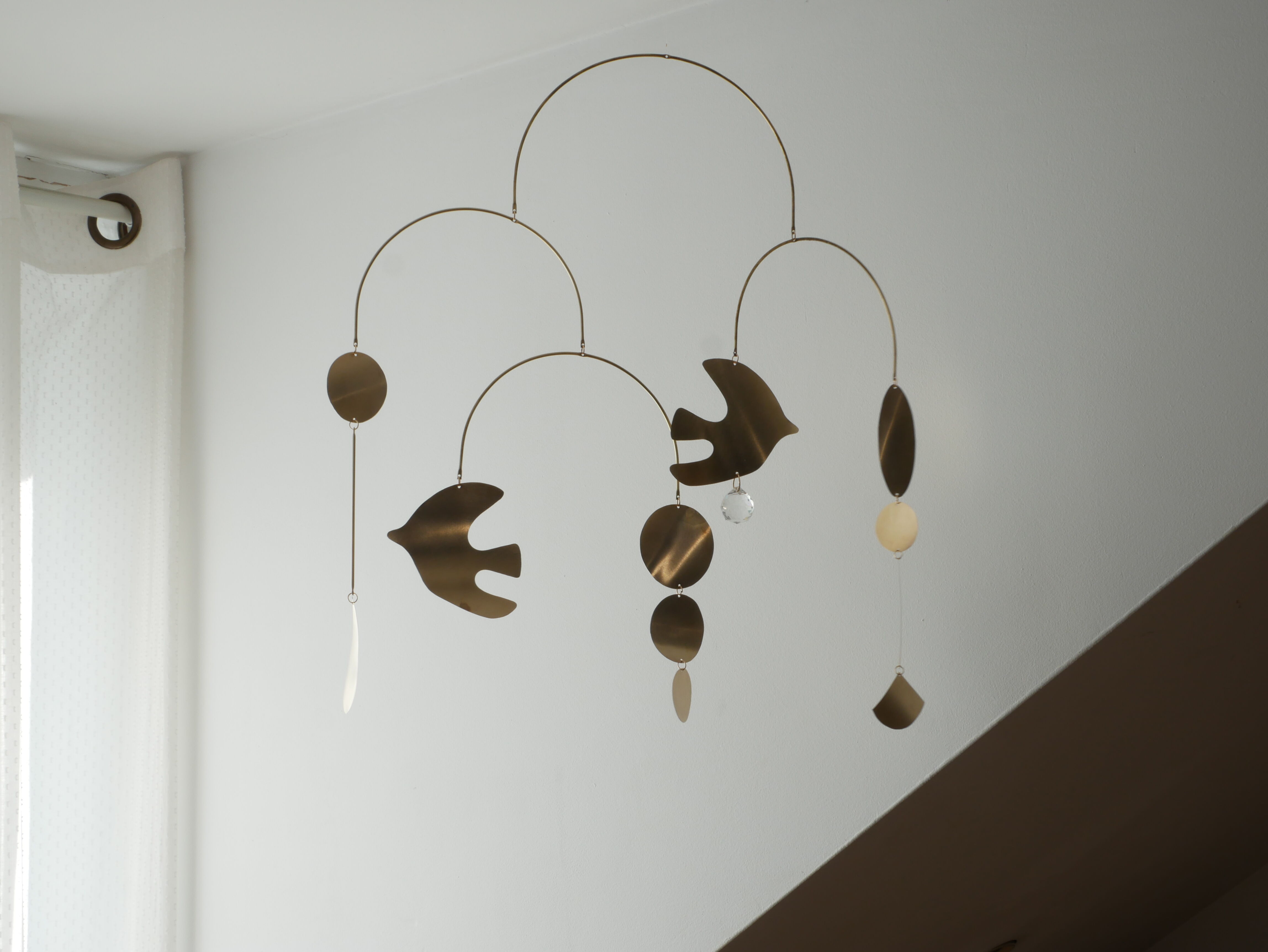 Mobile model Rana . Mobile in abstract brass.
