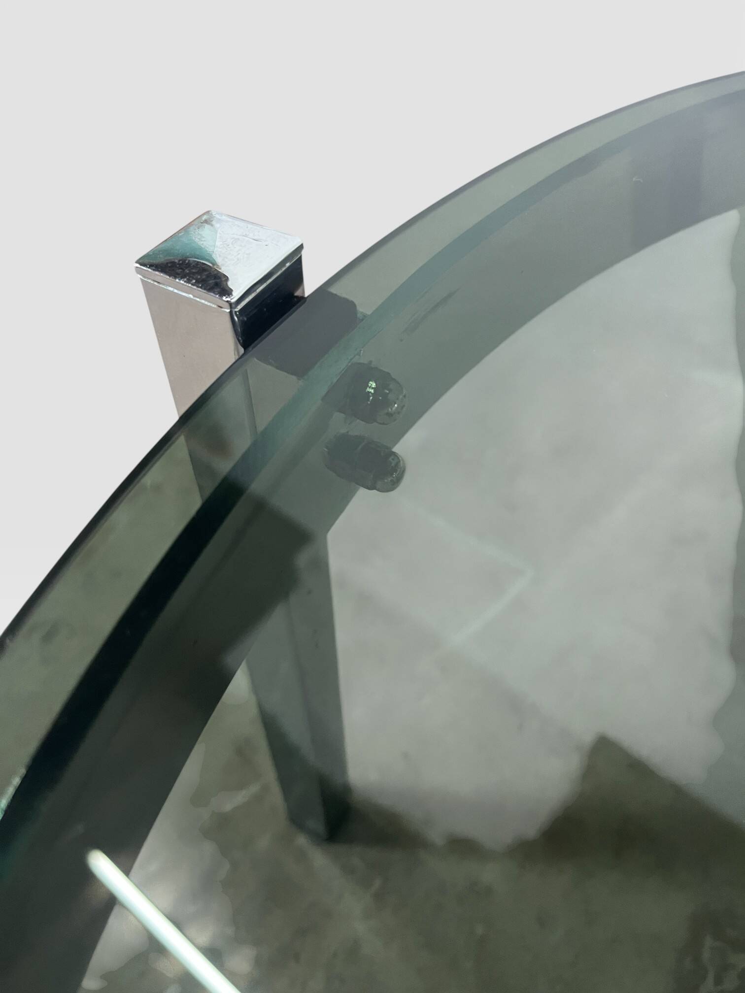 Vintage round coffee table with smoked glass and chrome.