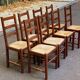 8 solid wood dining chairs with straw seats, farmhouse style