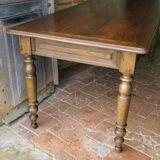Old French farmhouse table in walnut with turned legs.