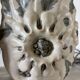 Pair of white glazed stoneware lamp bases, 20th-century floral decoration.