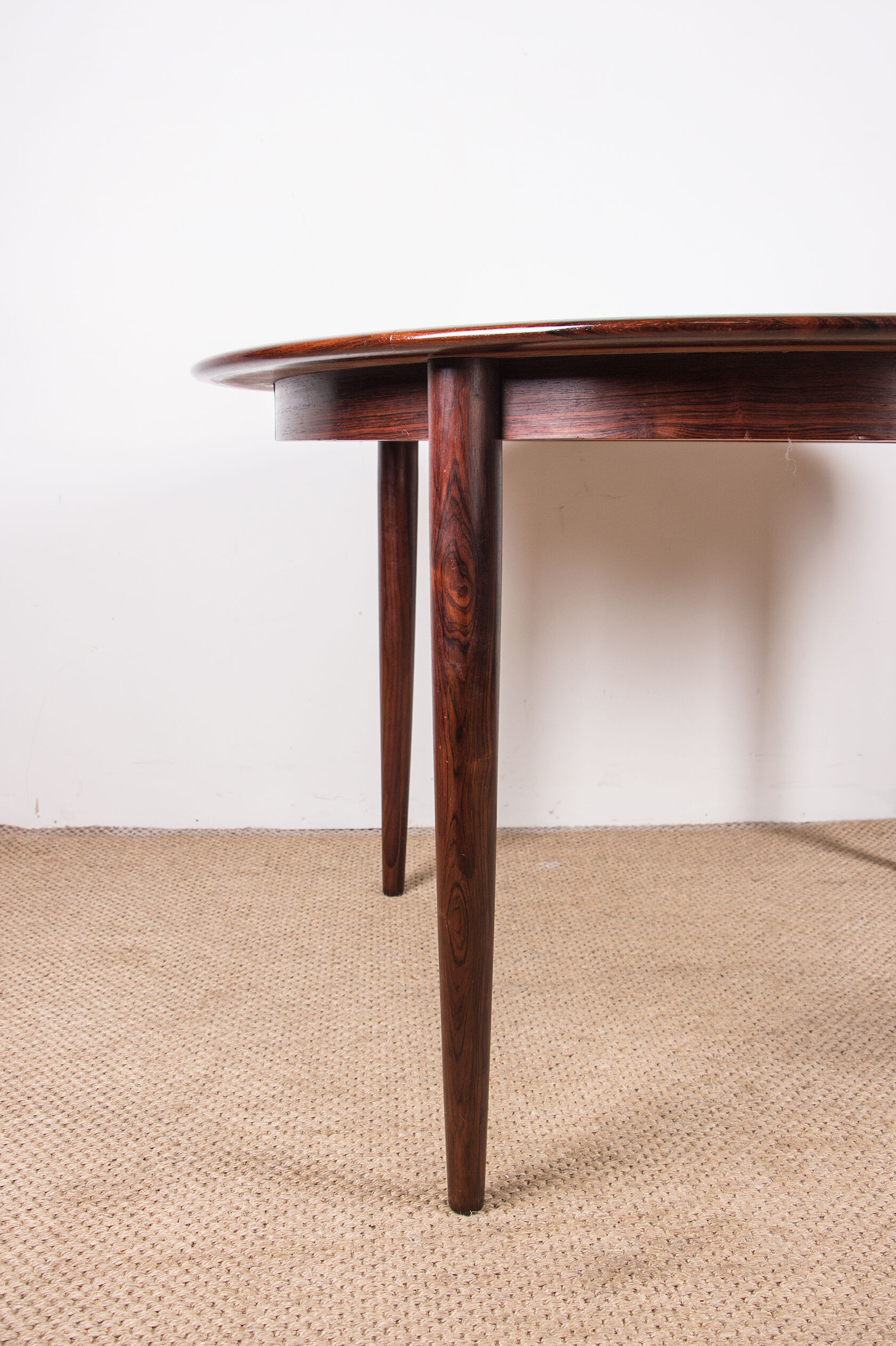 Danish extendable dining table in Rio Rosewood model 55 by Arne Vodder for Sibast 1958.