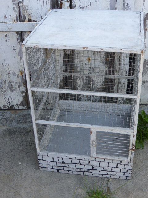 Vintage bird cage, made of wood and chicken wire metal square mesh