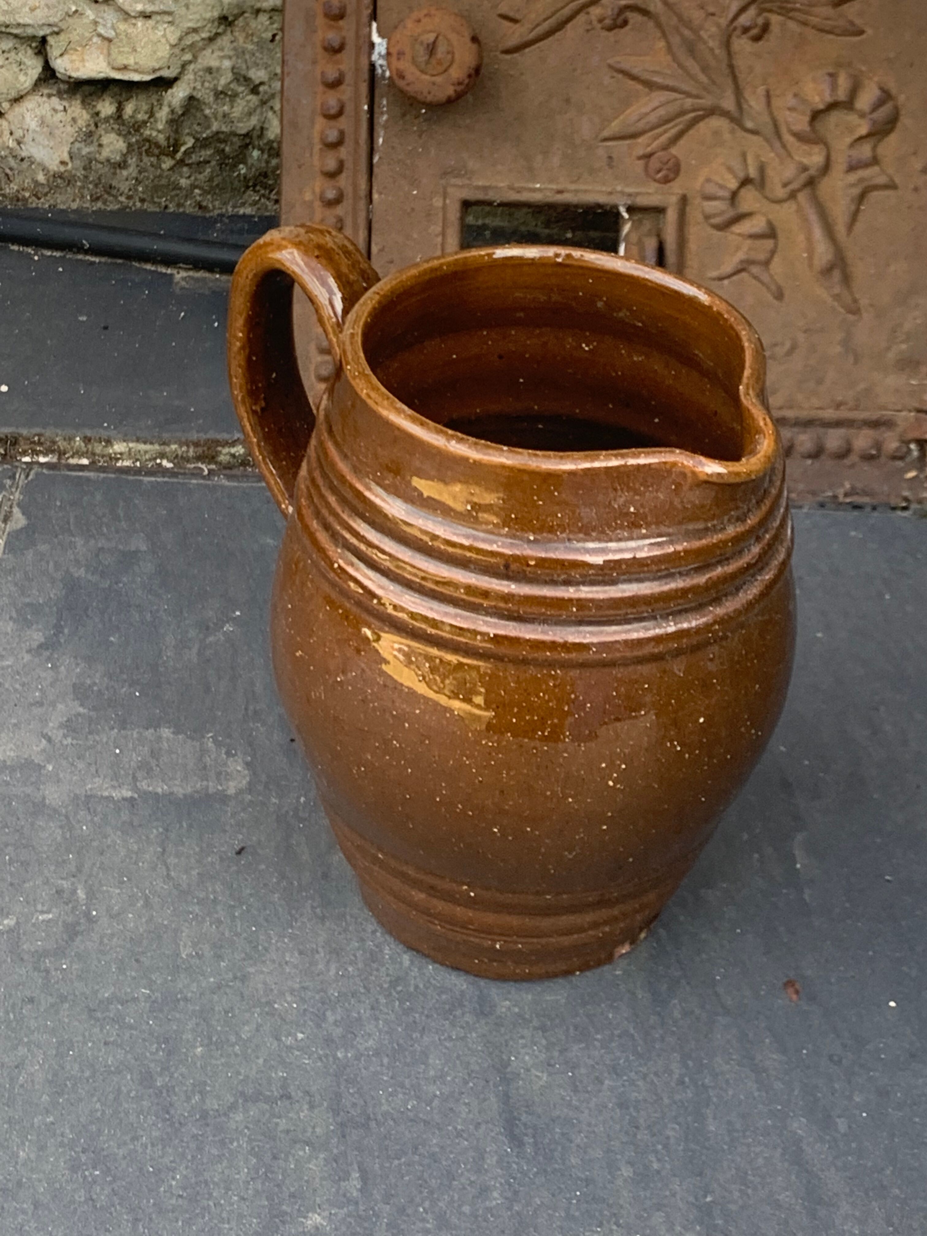 Pitcher old cider jug in glazed sandstone