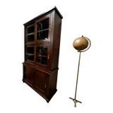 Vintage wooden display cabinet with sliding doors.