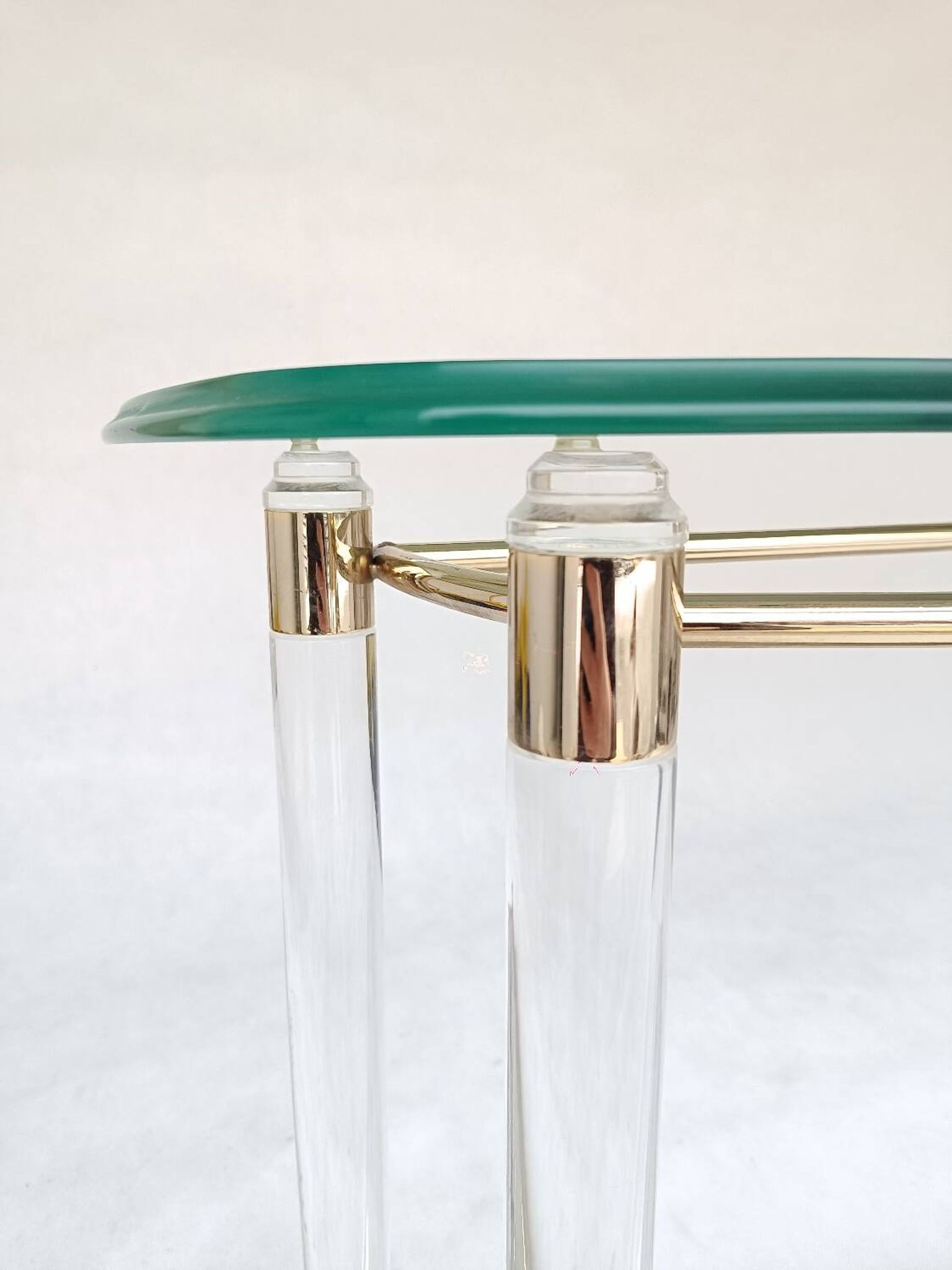 Hollywood Regency console table in lucite, glass and gold metal. 1980s