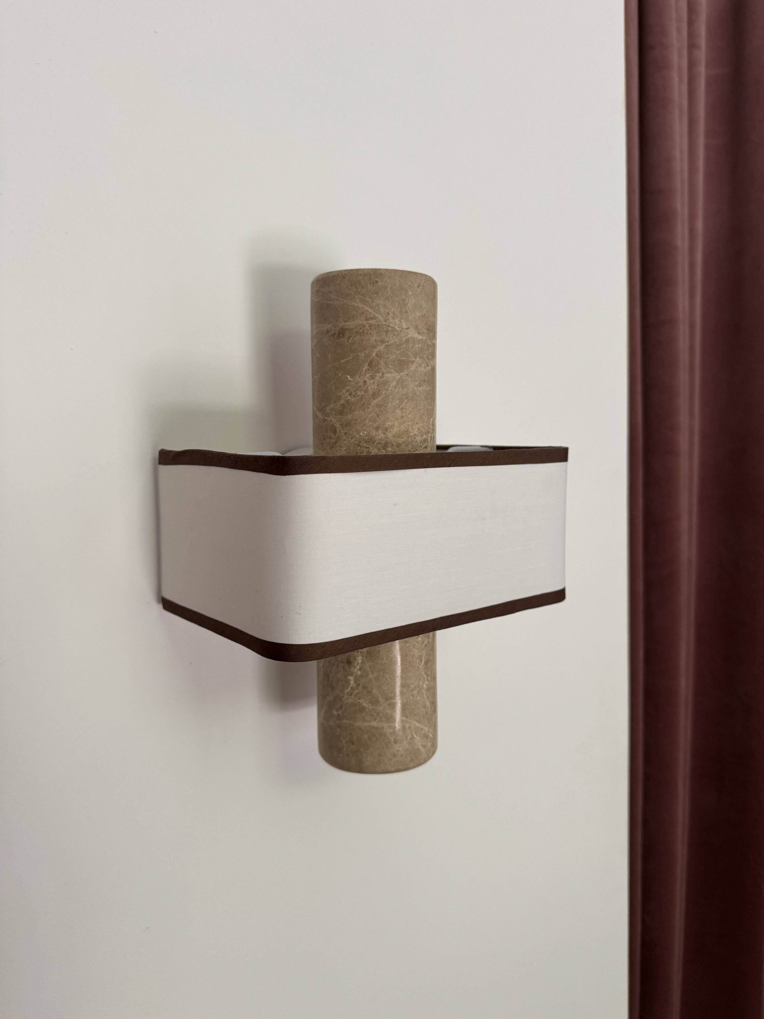 Pair of marble wall lights with fabric shades