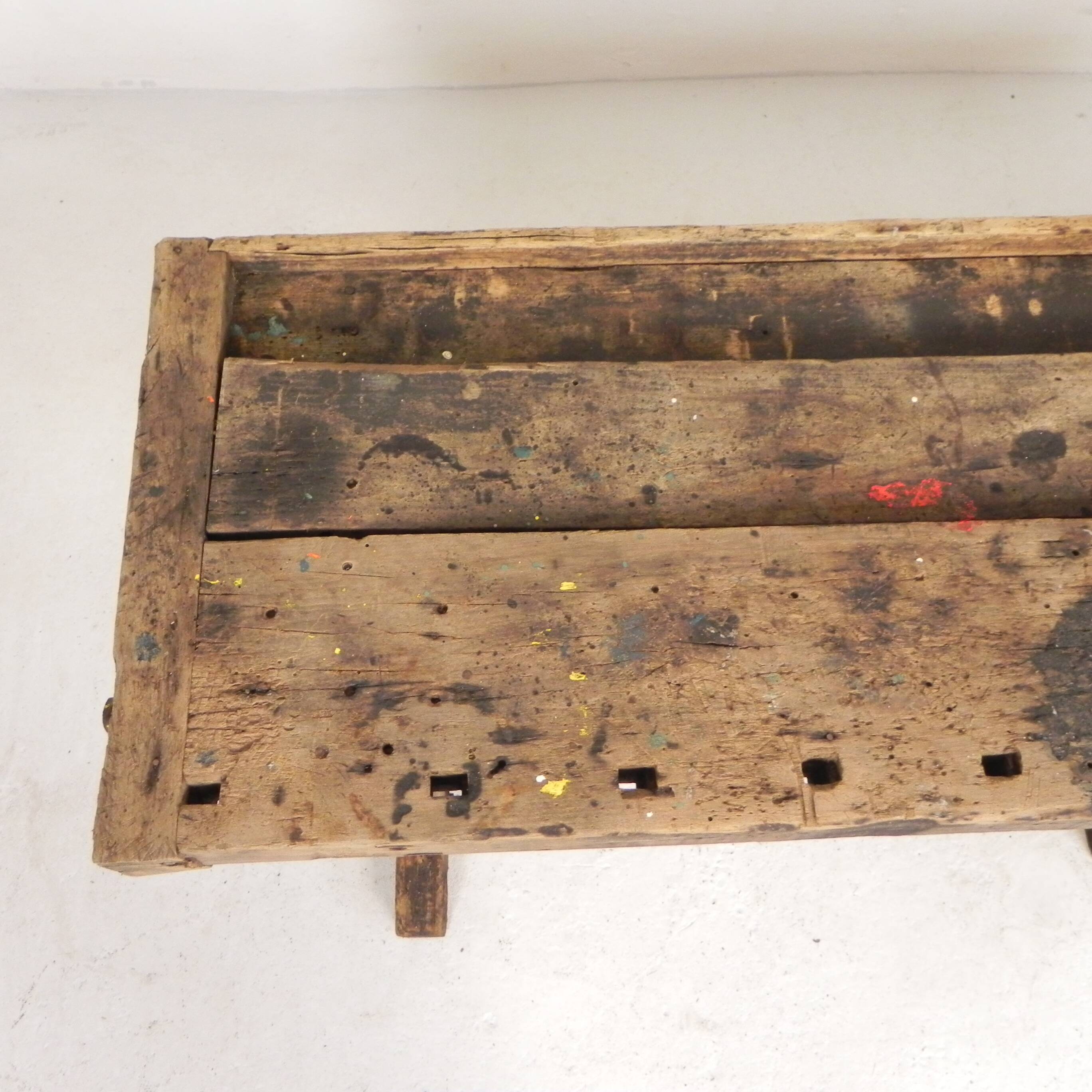 Wooden industrial workbench with vice, 194 cm long, 1930s.