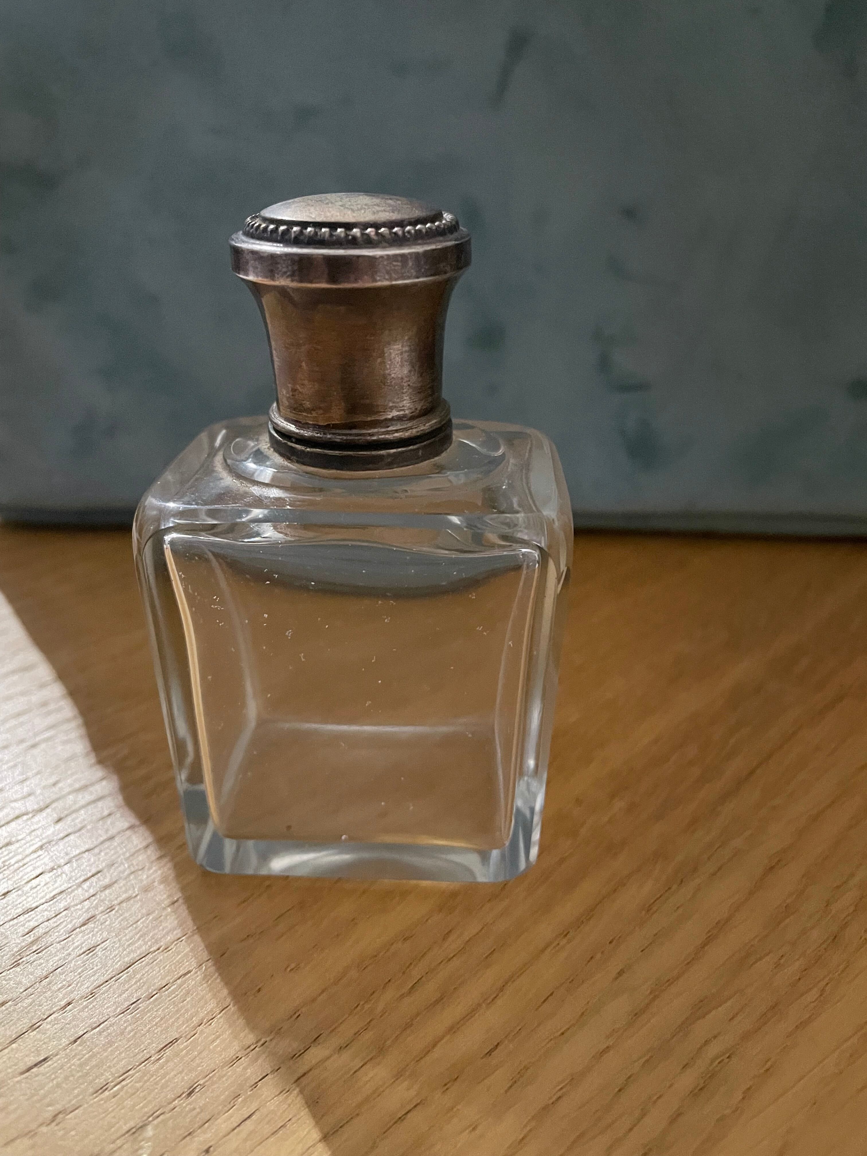 Old perfume bottle silver metal cap
