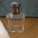 Old perfume bottle silver metal cap