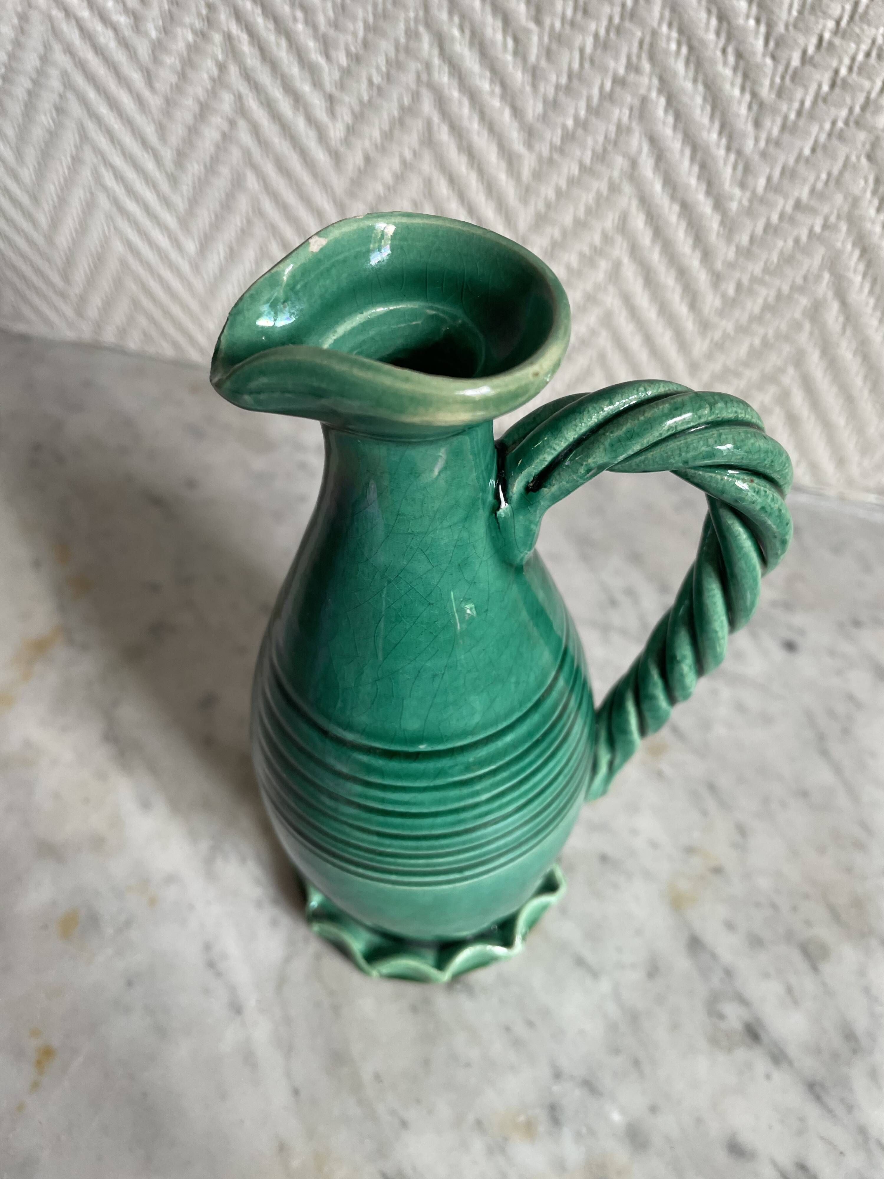 Small green ceramic pitcher