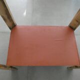 Console, small red accent table.