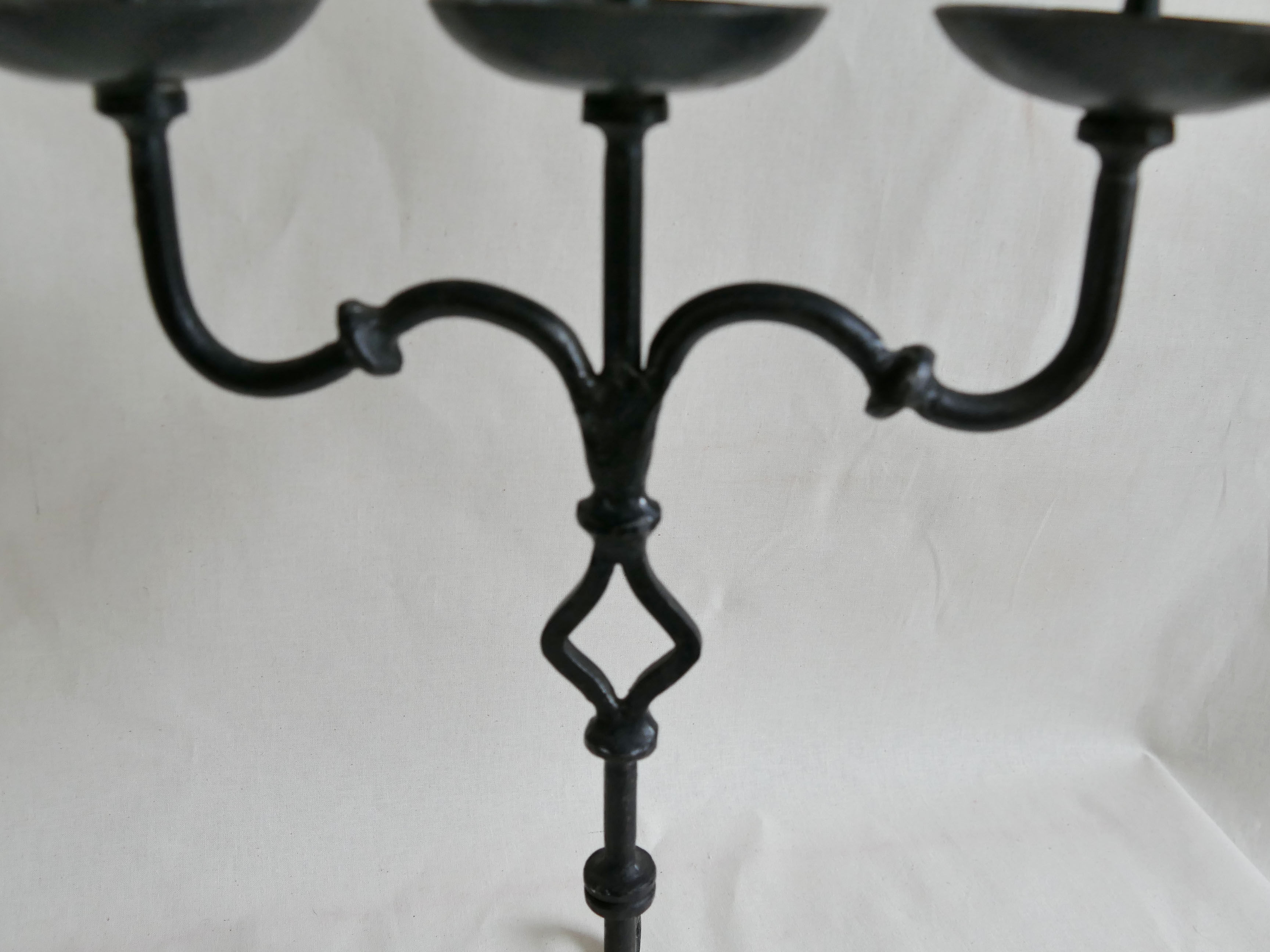Pair of antique wrought iron chandeliers