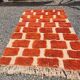 Large Moroccan Berber rug in orange and ecru wool, 400 x 300 cm.