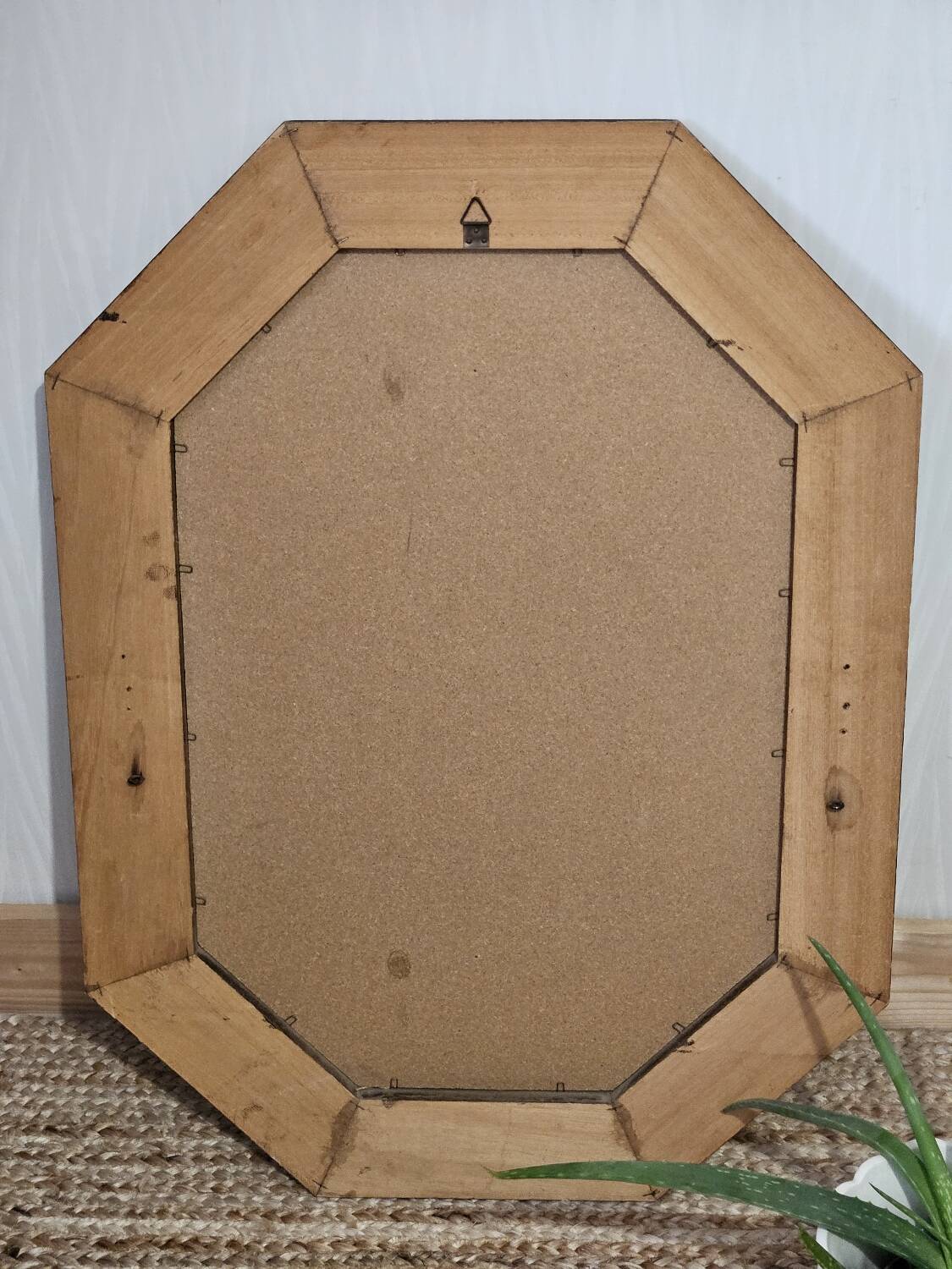 Bevelled mirror with neoclassical parcloses from the 20th century.