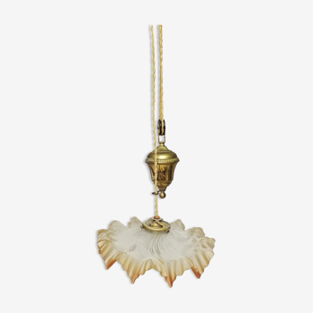 Glass chandelier with brass counterweight