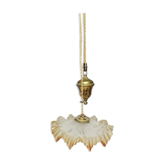 Glass chandelier with brass counterweight