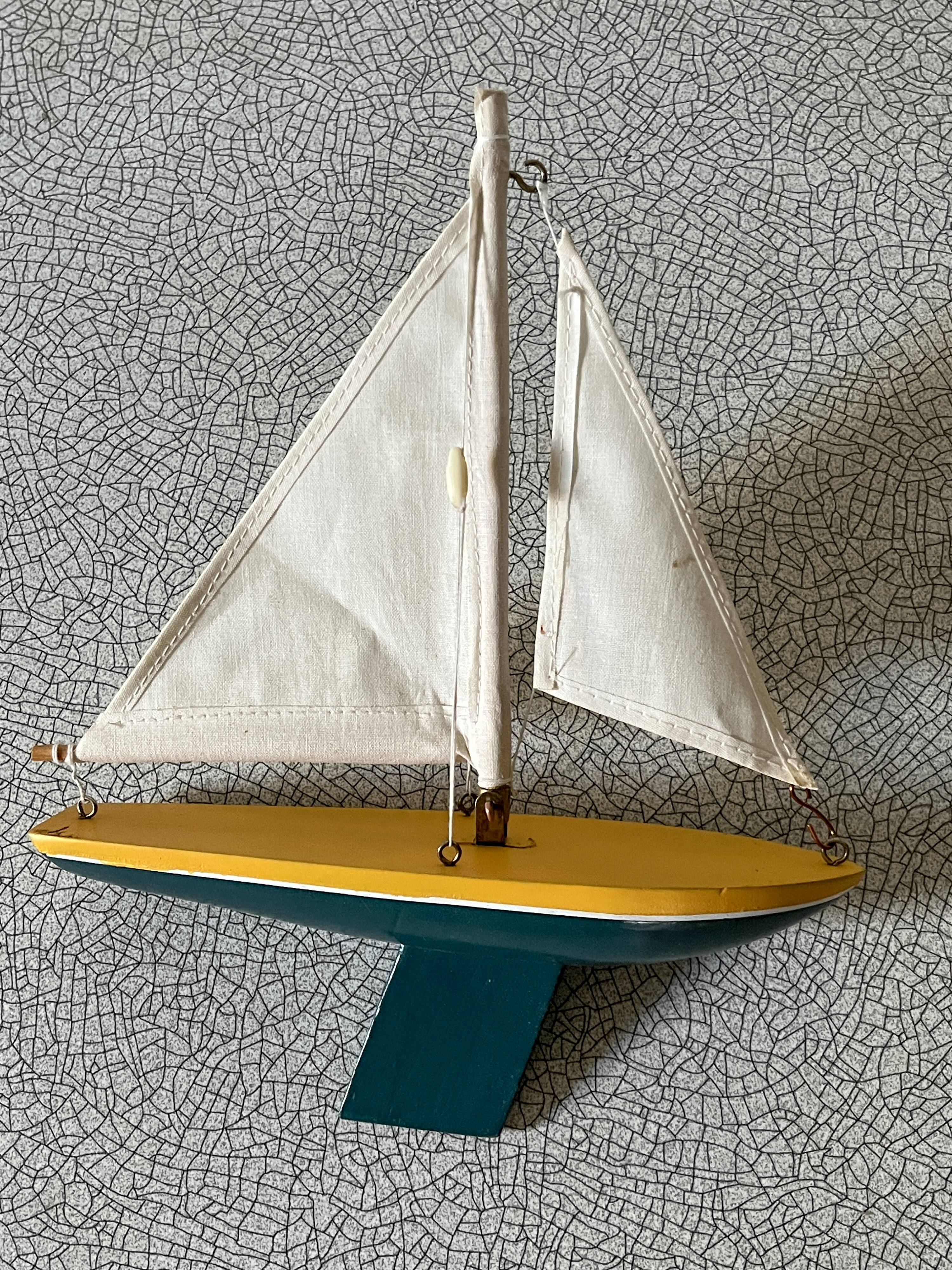 Small wooden sailboat, pretty colors