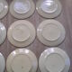Lot de 12 assiettes plates anciennes en faience