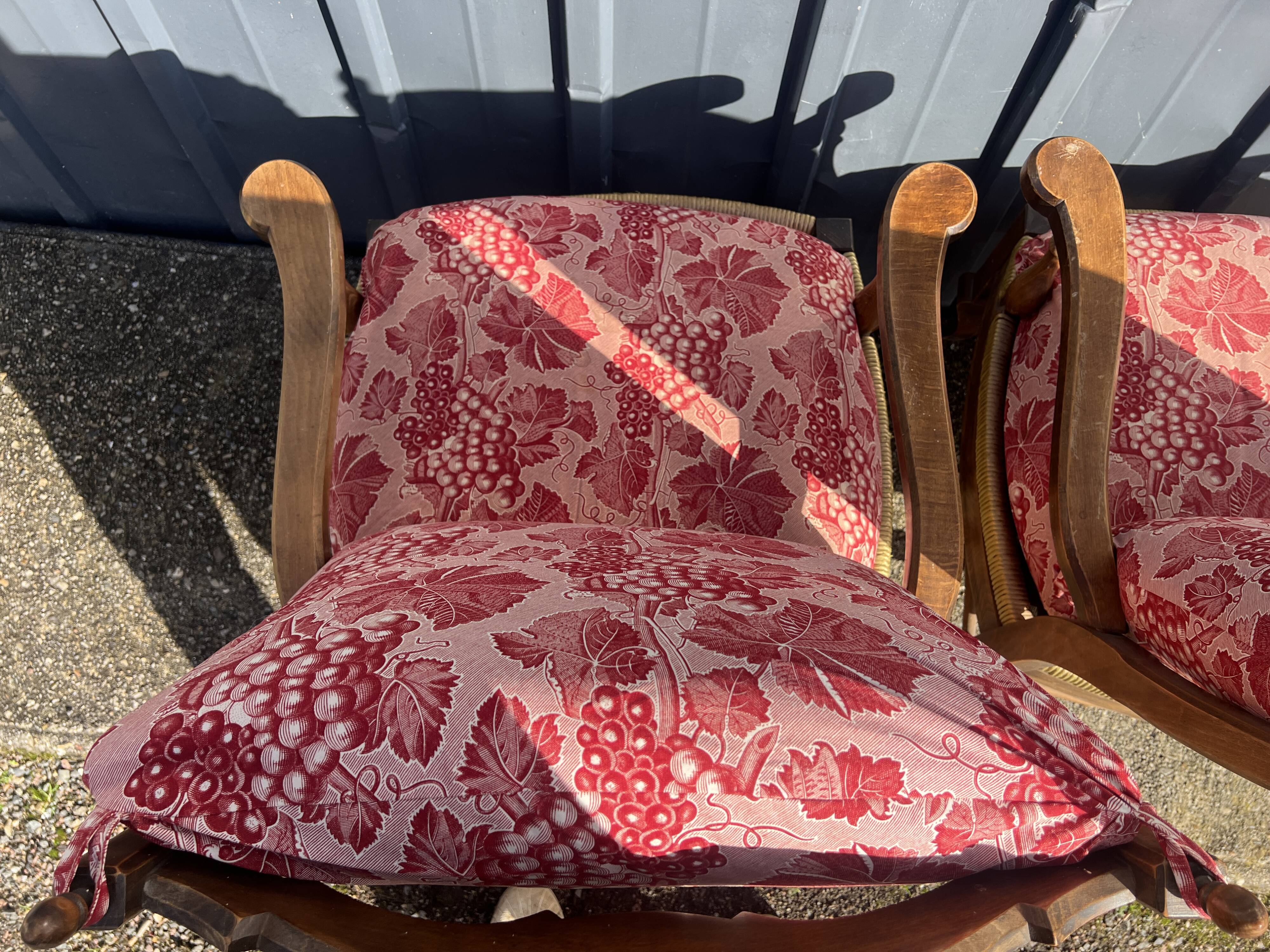 pair of rustic wood and fabric armchairs