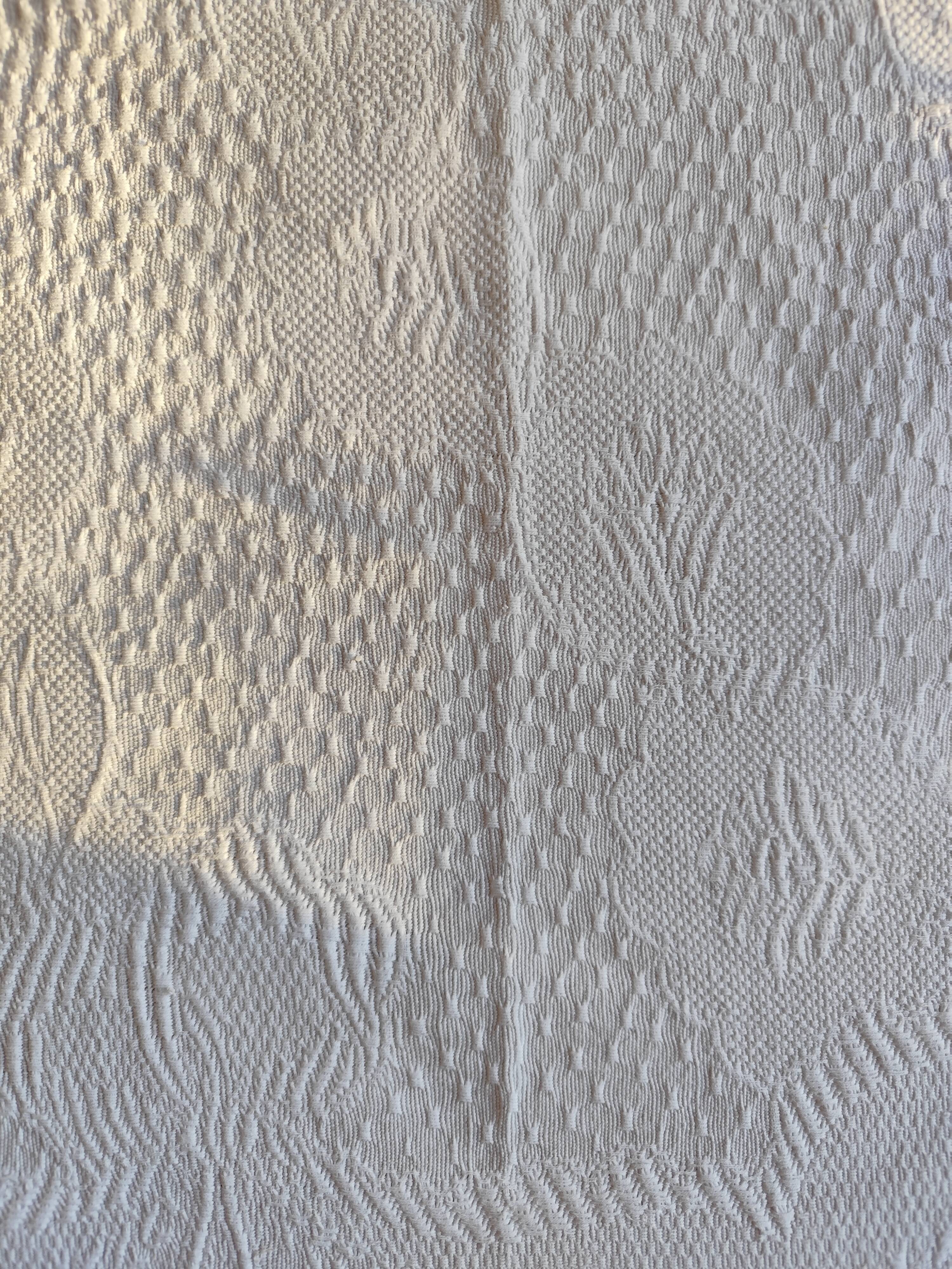 White woven cotton bedspread with fringes