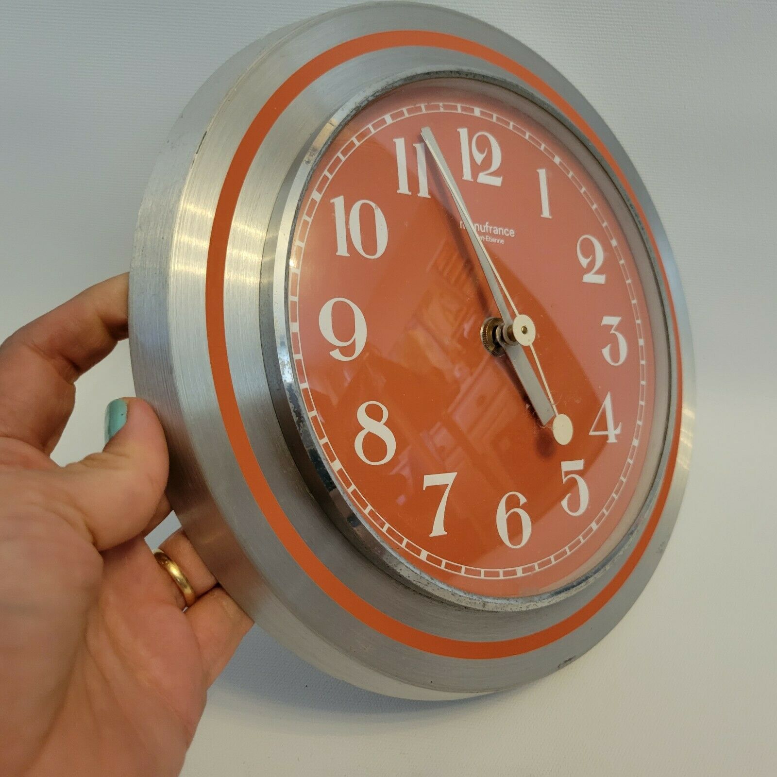 Old orange aluminum clock Manufrance Saint-Etienne