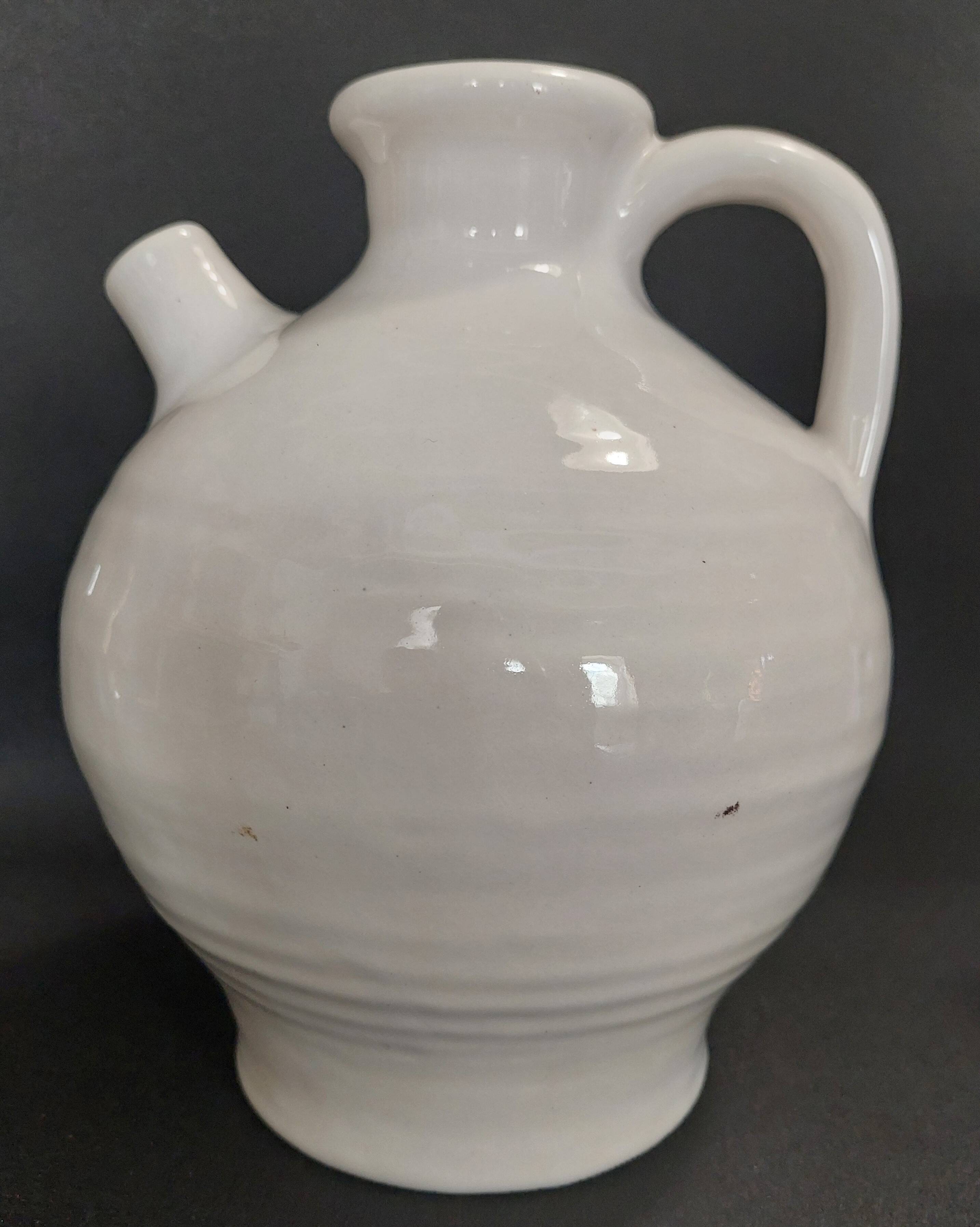 White ceramic goat-shaped creamer, first half of the 20th century.