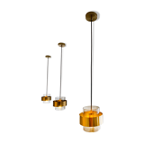 Brass and glass suspensions