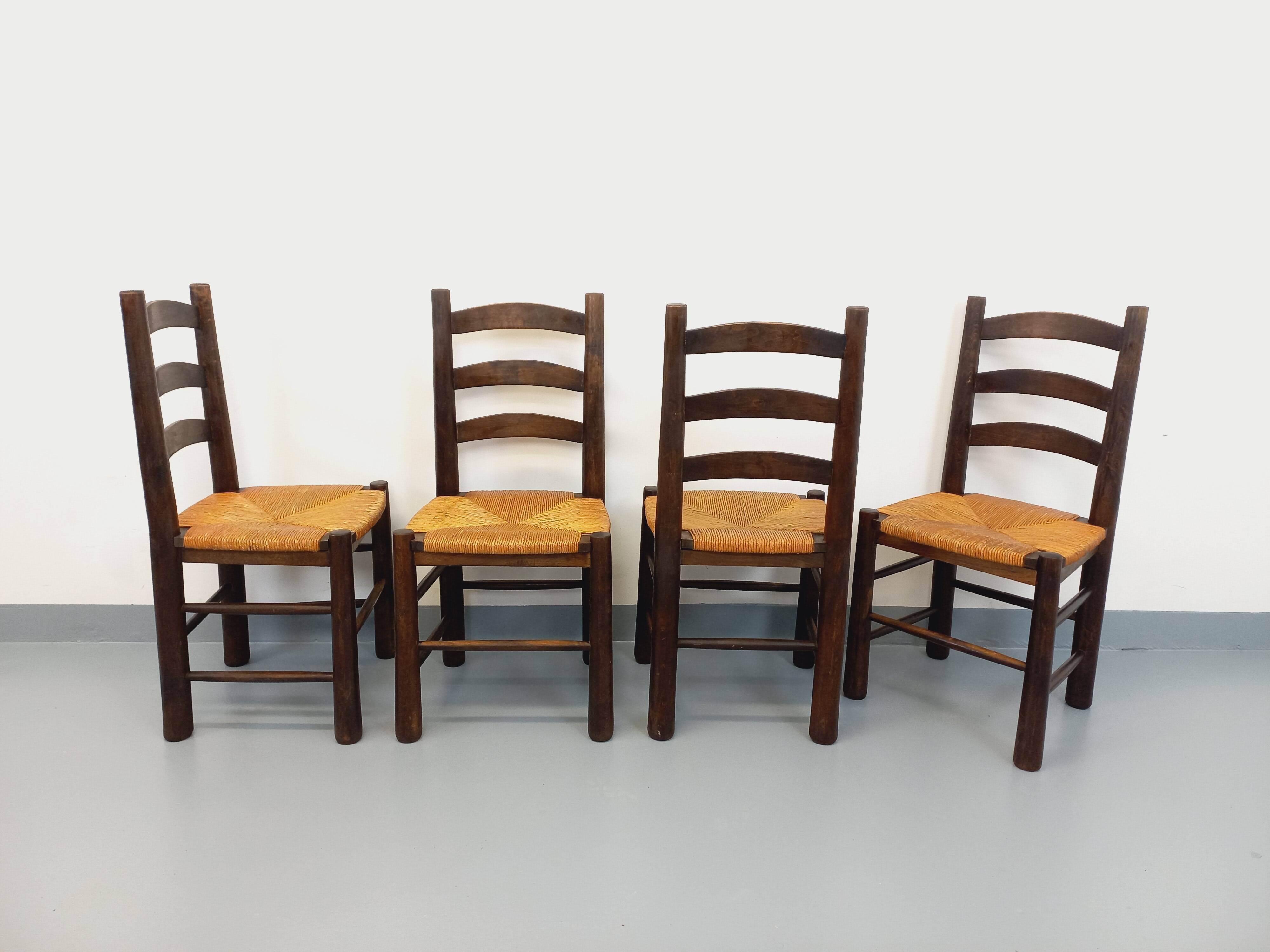 Set of 4 vintage brutalist chairs by Georges Robert in wood and straw.