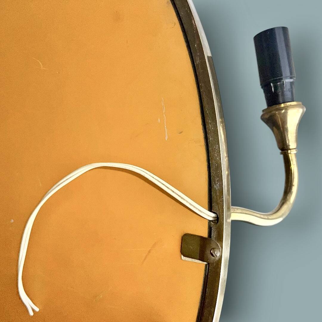 Oval wall mirror in gilded brass with double sconces – 1950s/60s