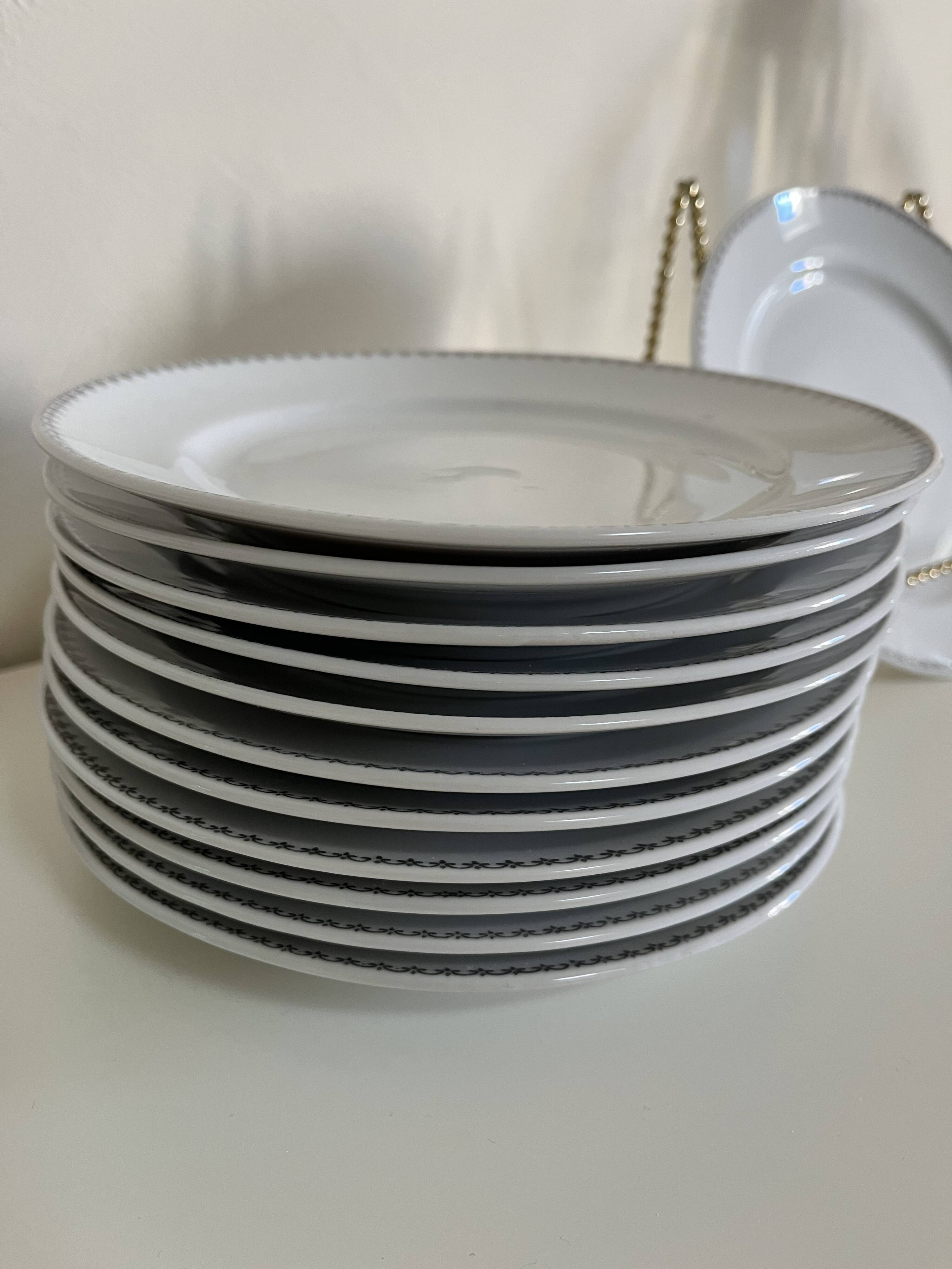 12 white porcelain plates with silver edging