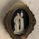Miniature on ivory, oval brass frame.