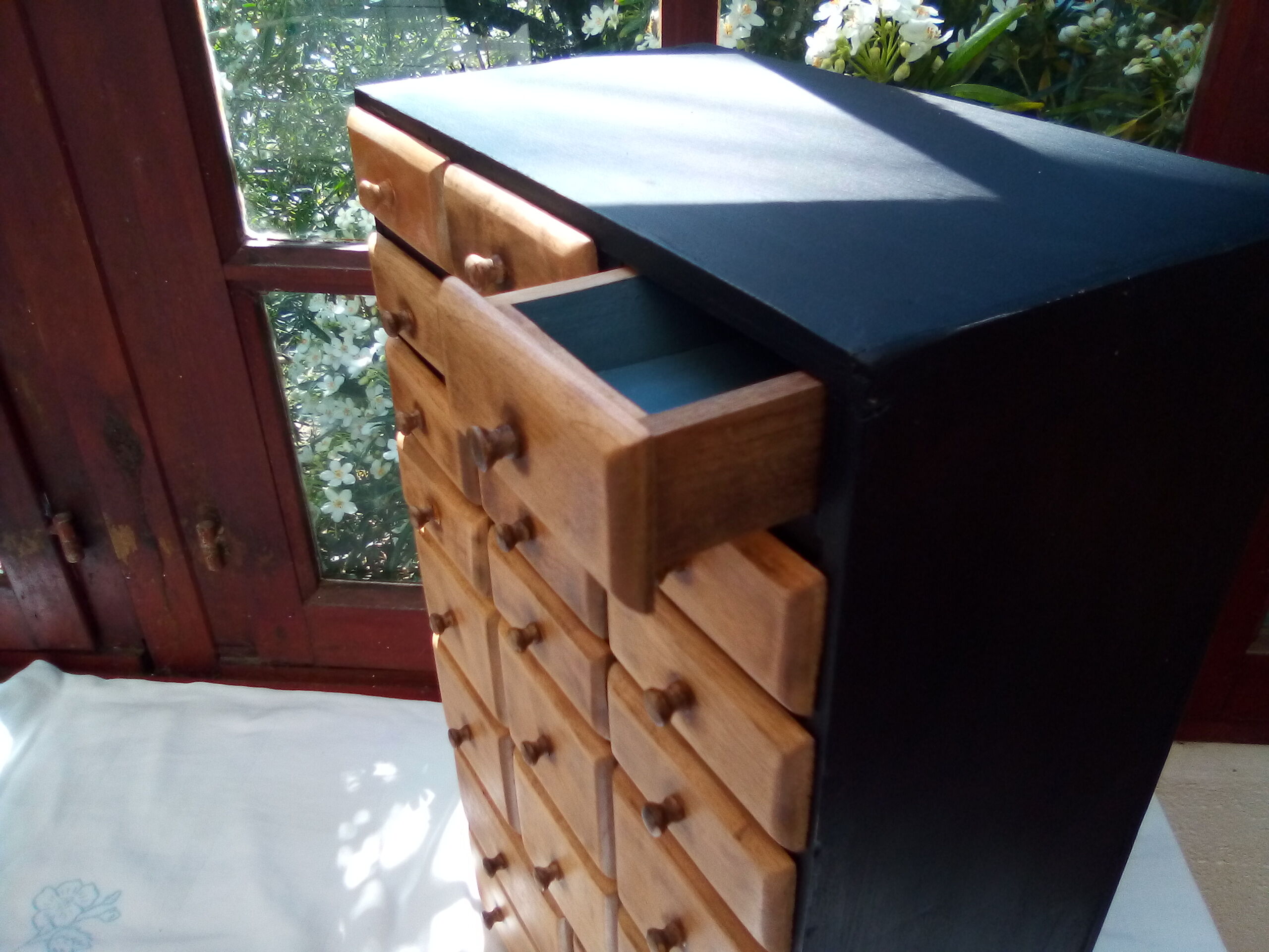 Small furniture with small drawers says layette