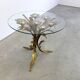 Charming metal flower coffee table or side table with a clear glass top. Made in Italy, attributed to Hans Kögl.