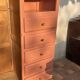 Asymmetrical vintage wardrobe painted in terracotta.