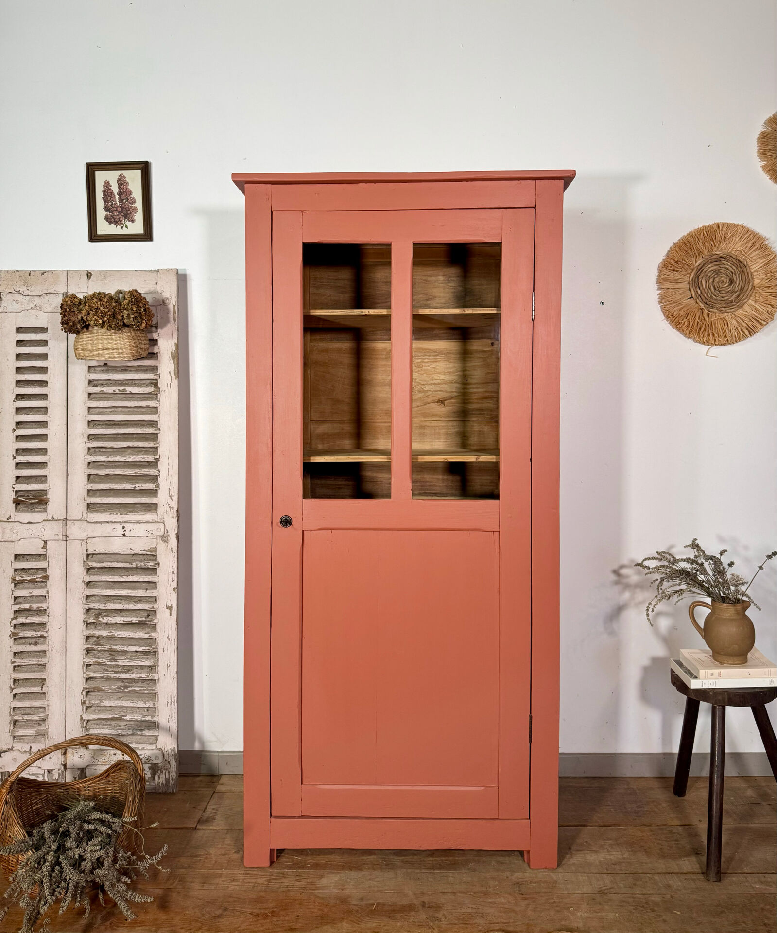 Antique glass-fronted terracotta cupboard