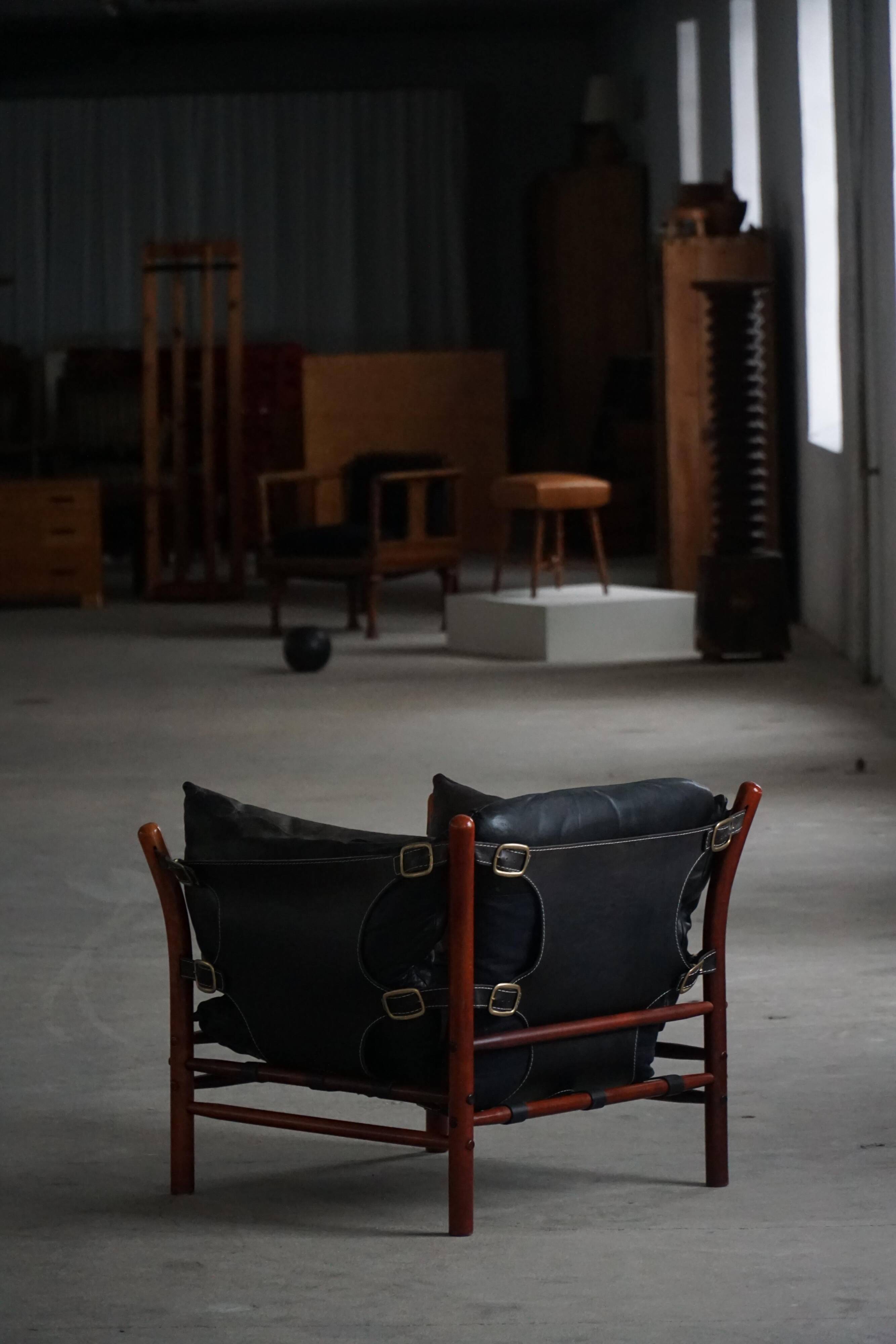 "Lounge chair 'Ilona' by Arne Norell in stained beech and leather, mid-20th century."