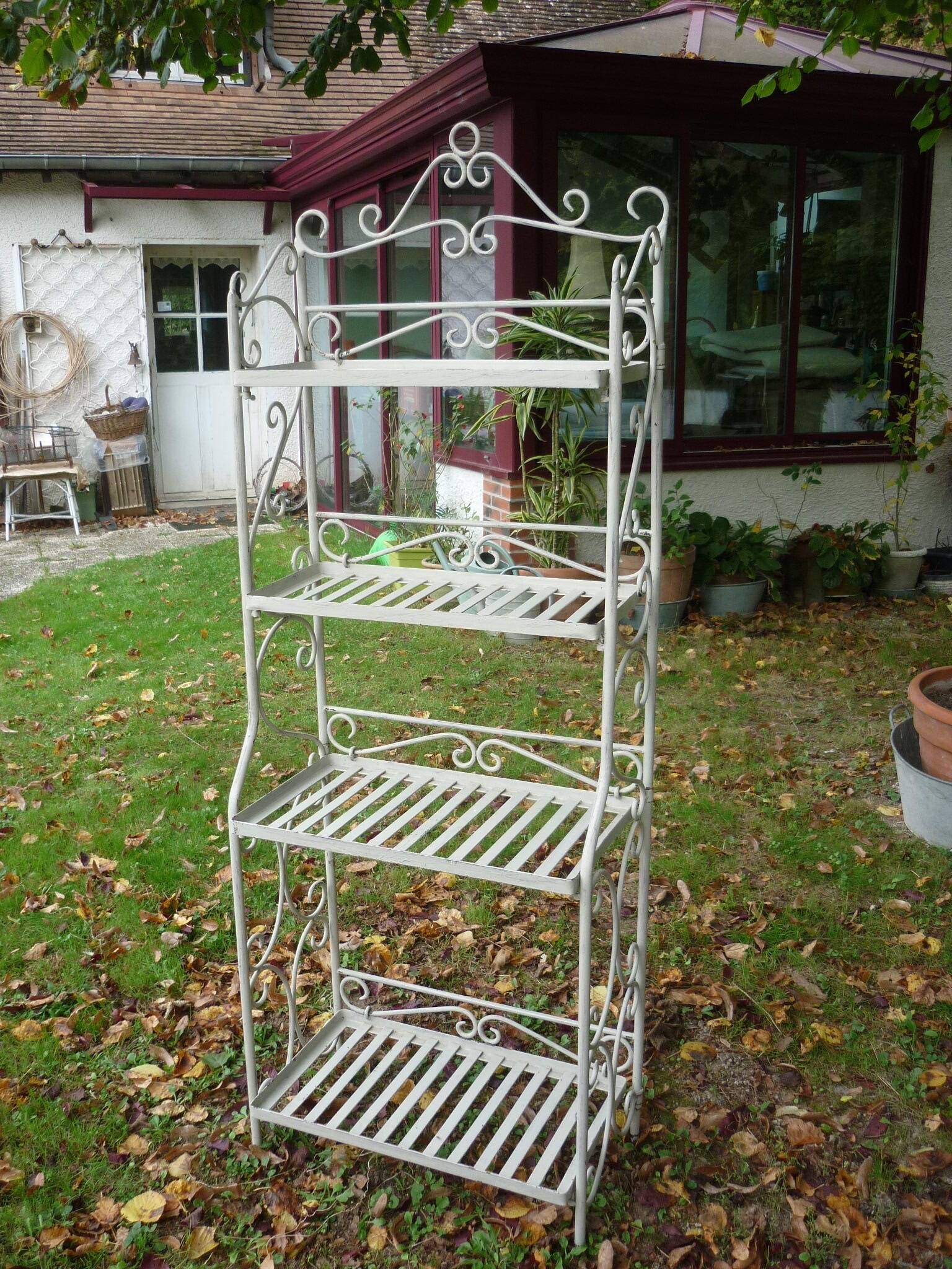 White wrought iron folding shelf