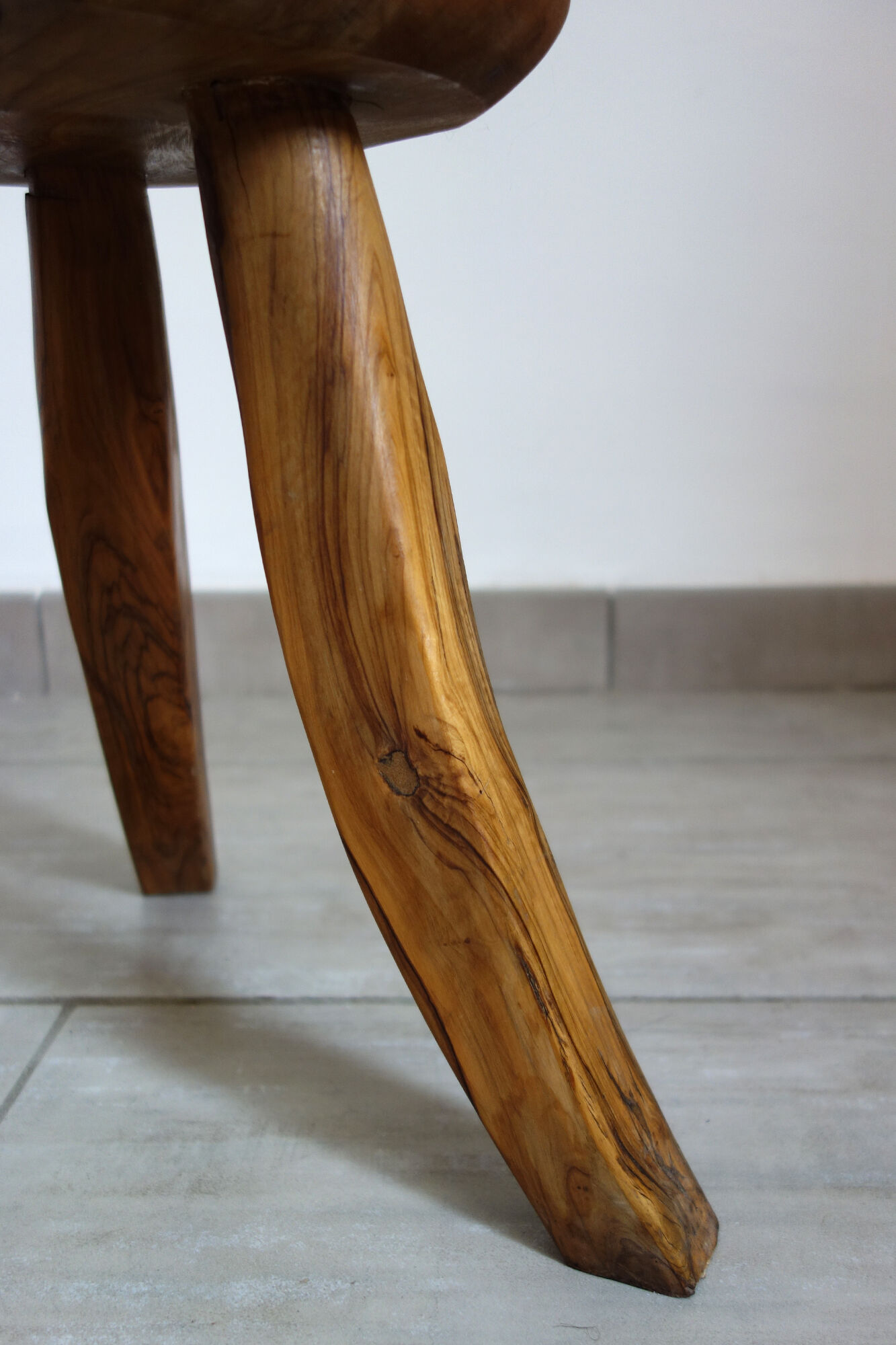 Brutalist stool made of olive wood